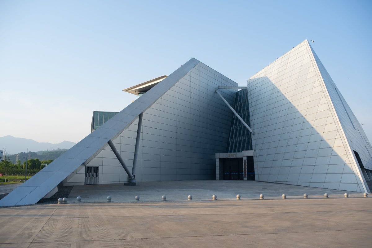 Contemporary geometric building with angular facade under clear skies