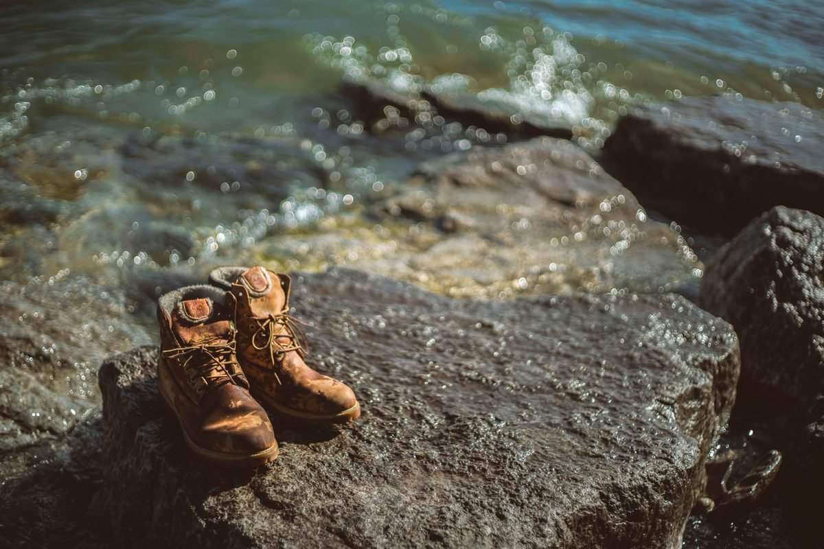 Hiking boots on volcanic rocks.