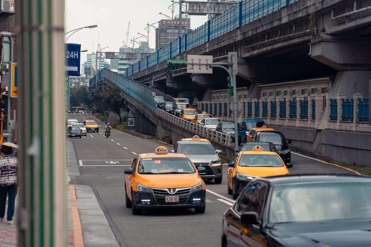 Urban street scene with yellow taxis in South Korea.