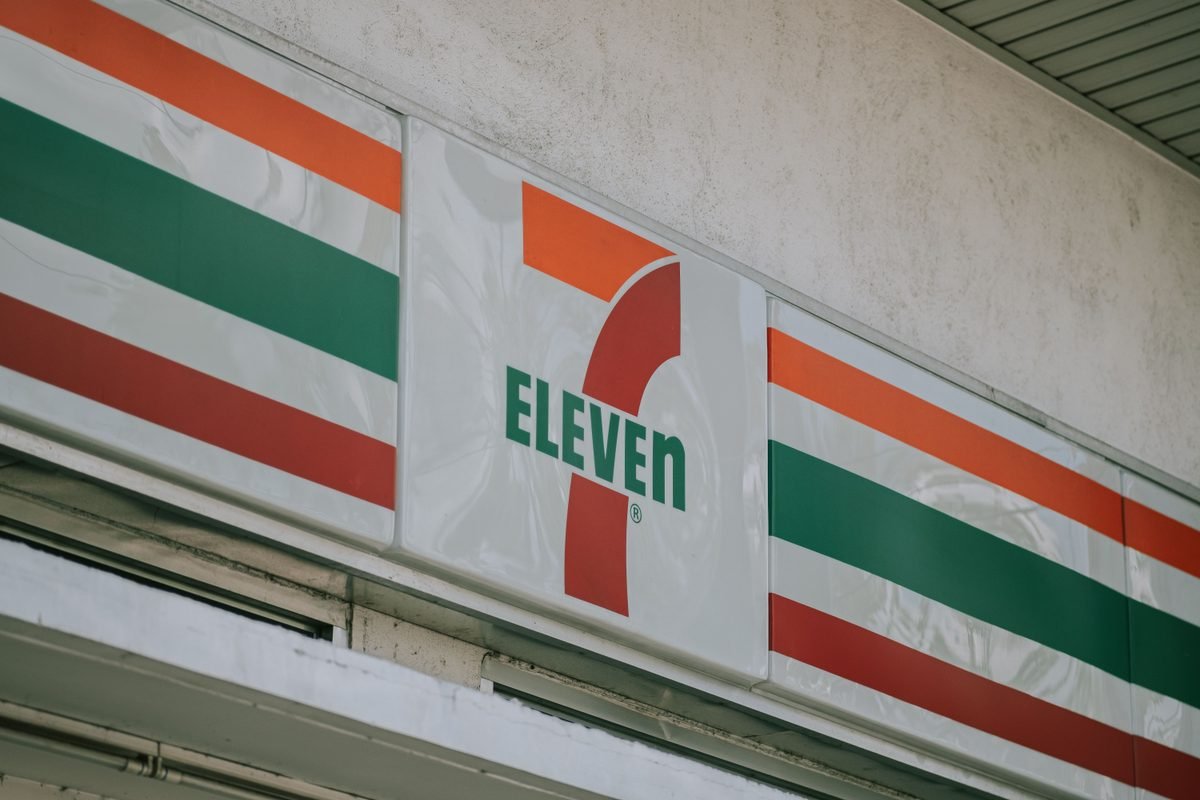 Close-up of a convenience store iconic sign above the entrance