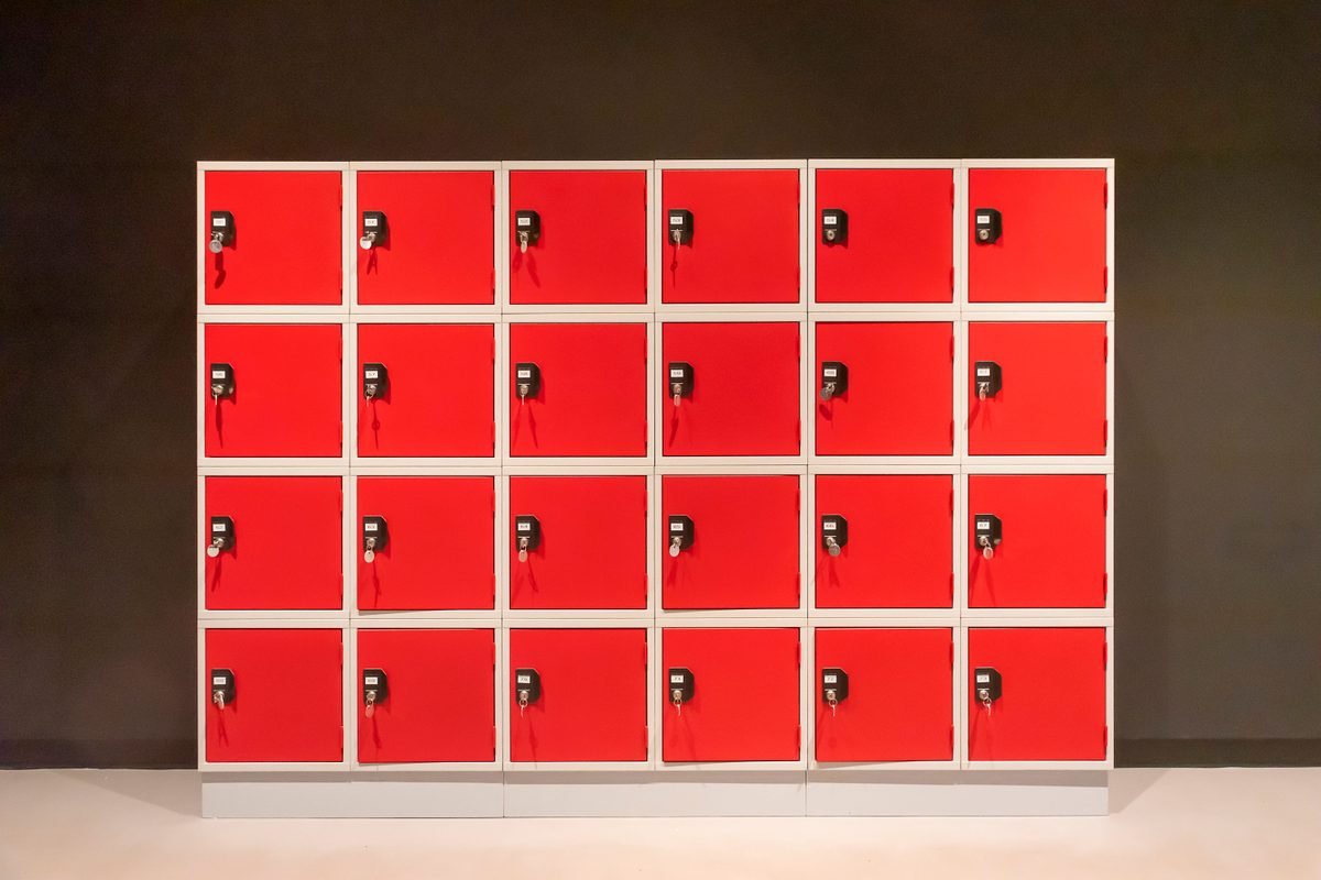 Simple indoor setup of vibrant red lockers in a row