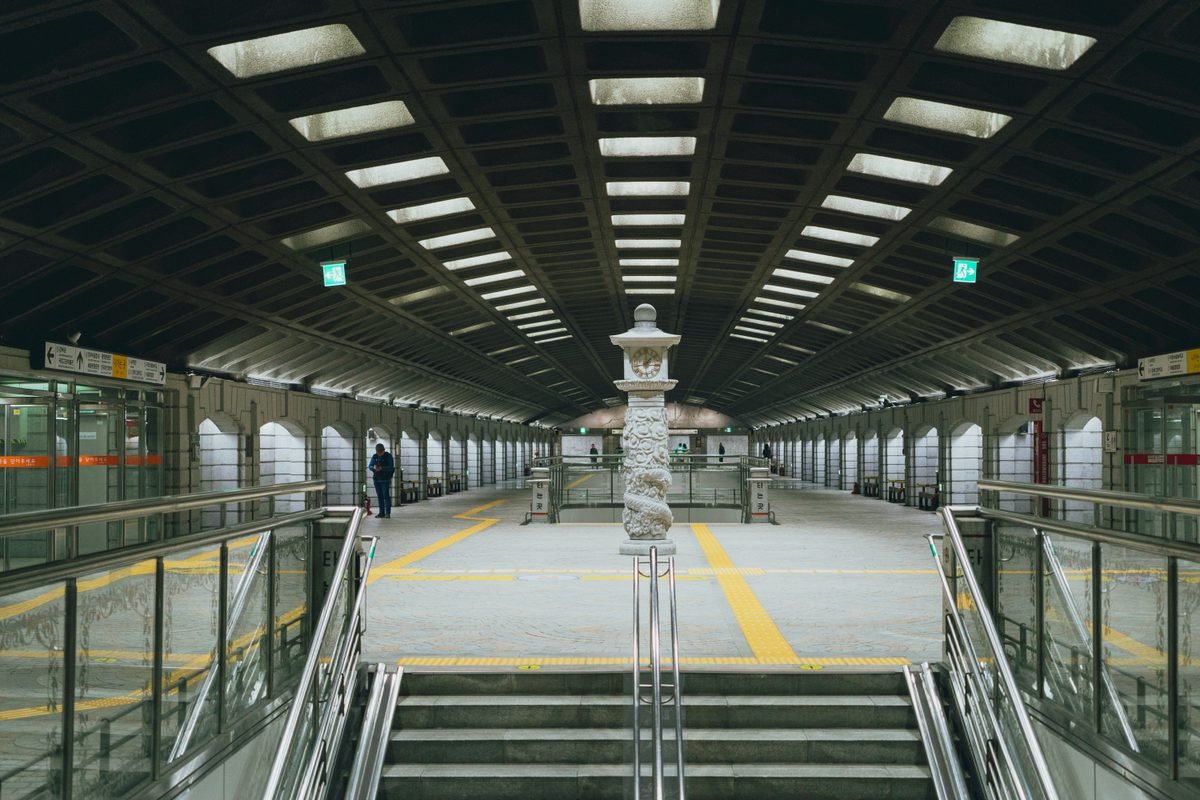 Symmetrical view of Gyeongbokgung Station interior in Seoul.