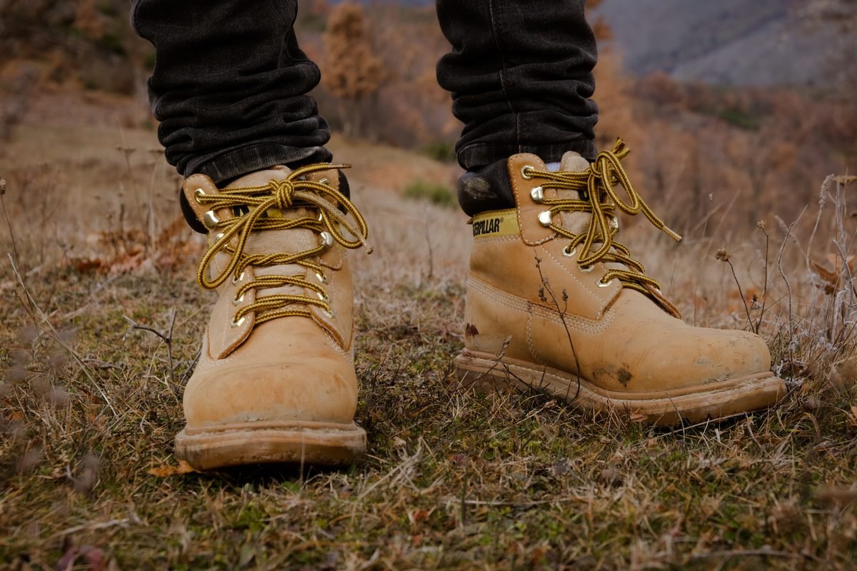 Sturdy hiking boots standing on rugged outdoor terrain