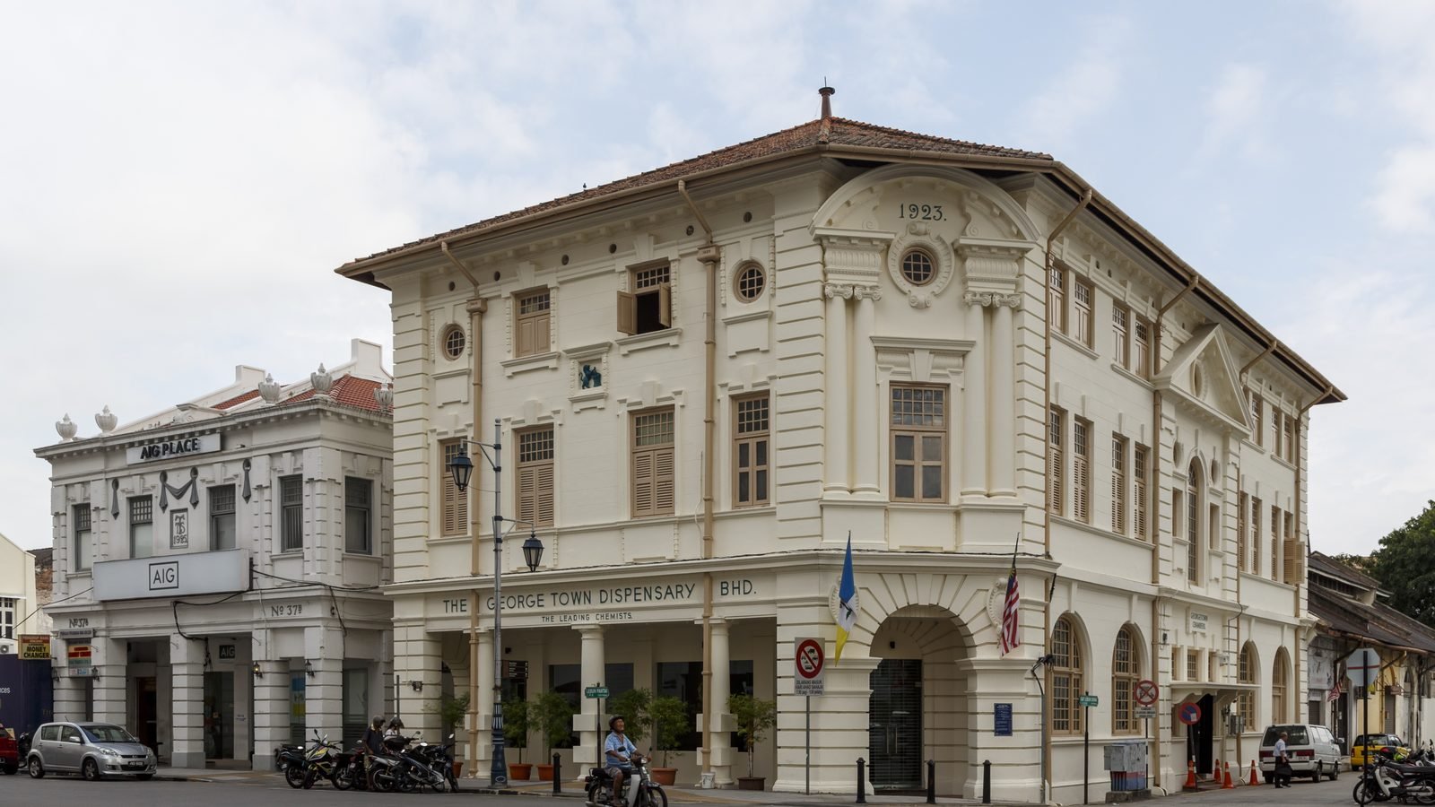 Historic white building of The George Town Dispensary at a street corner in George Town