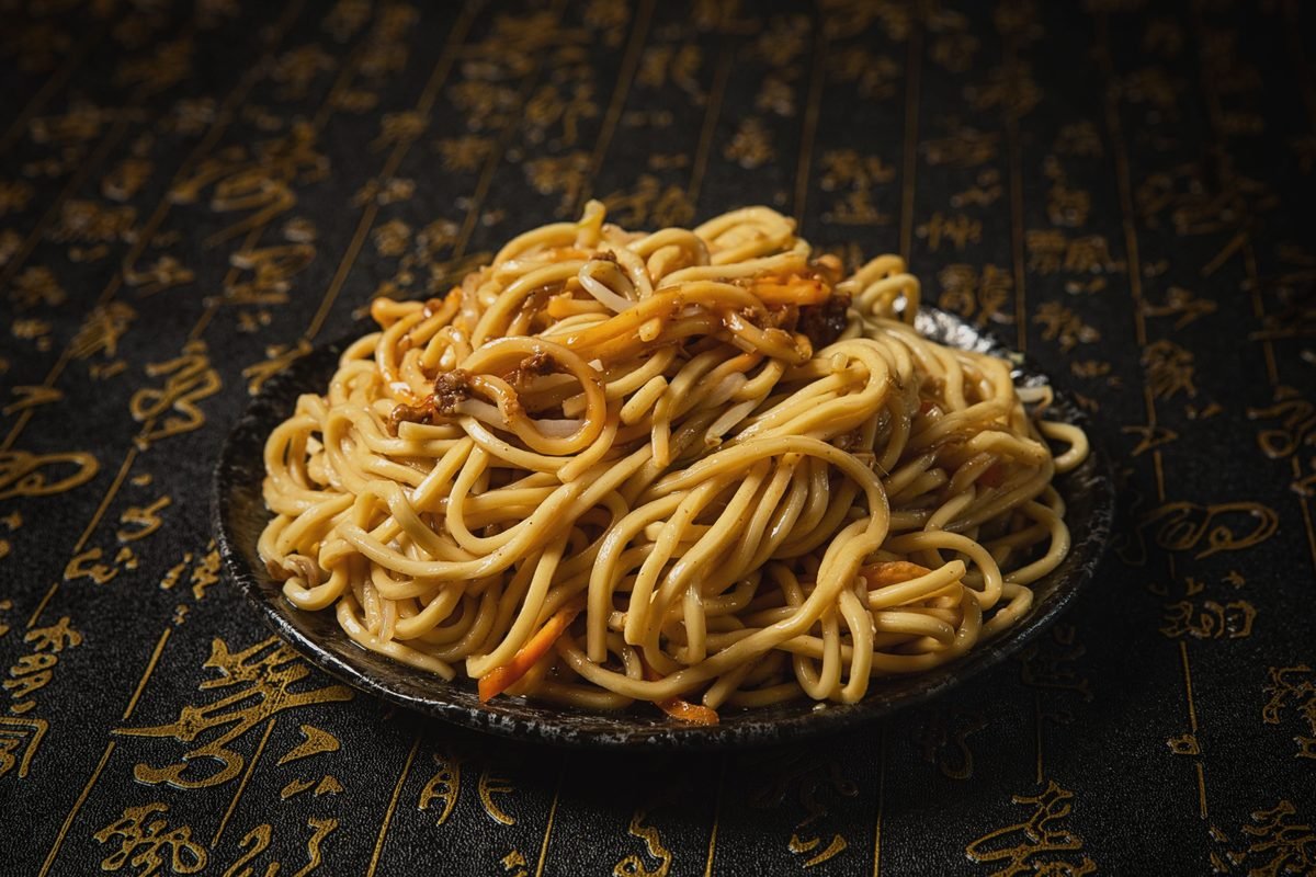 Plate of stir-fried noodles with bean sprouts and savory sauce
