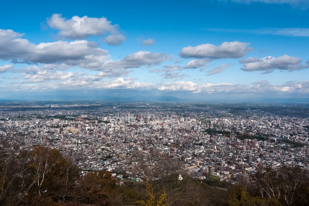 Panoramic daytime view of Sapporo city from the summit of Mount Moiwa.