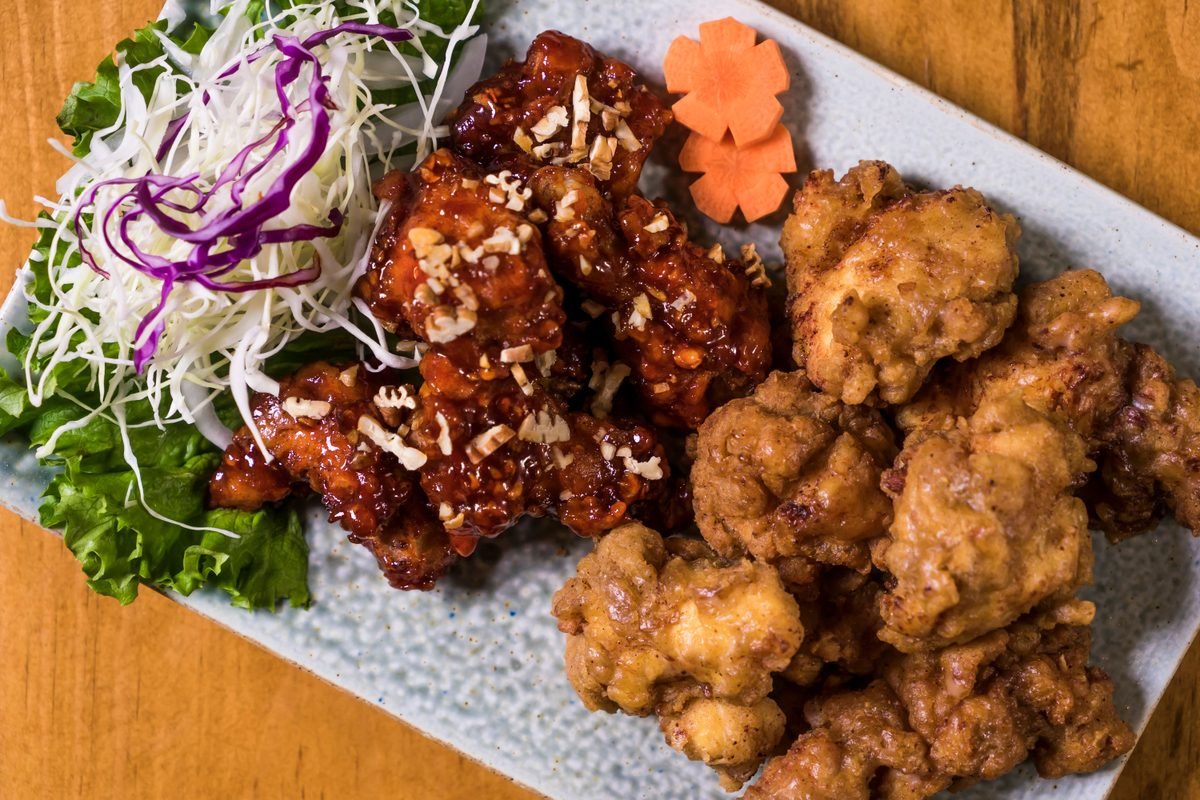 Platter of Korean fried chicken with fresh salad garnish