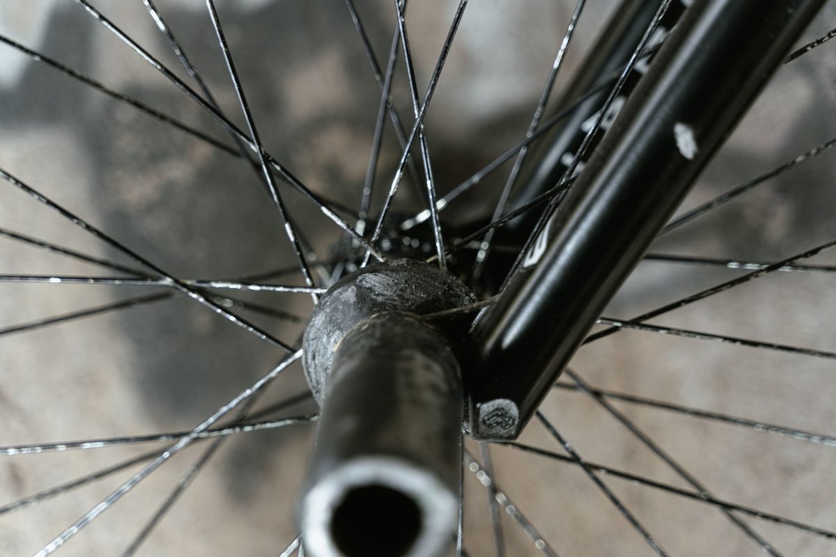 Close-up of bicycle spokes and wheel hub structure.