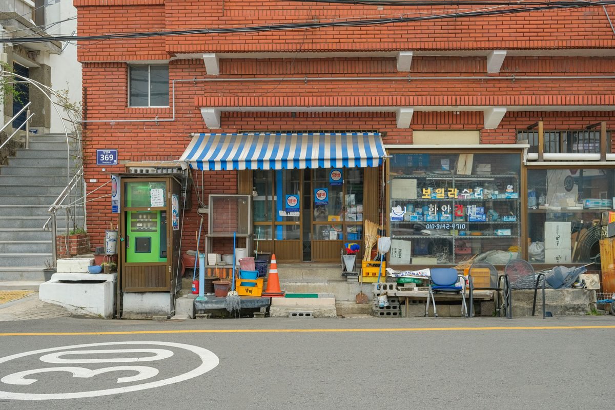 Traditional storefront with retro striped awning in Seoul