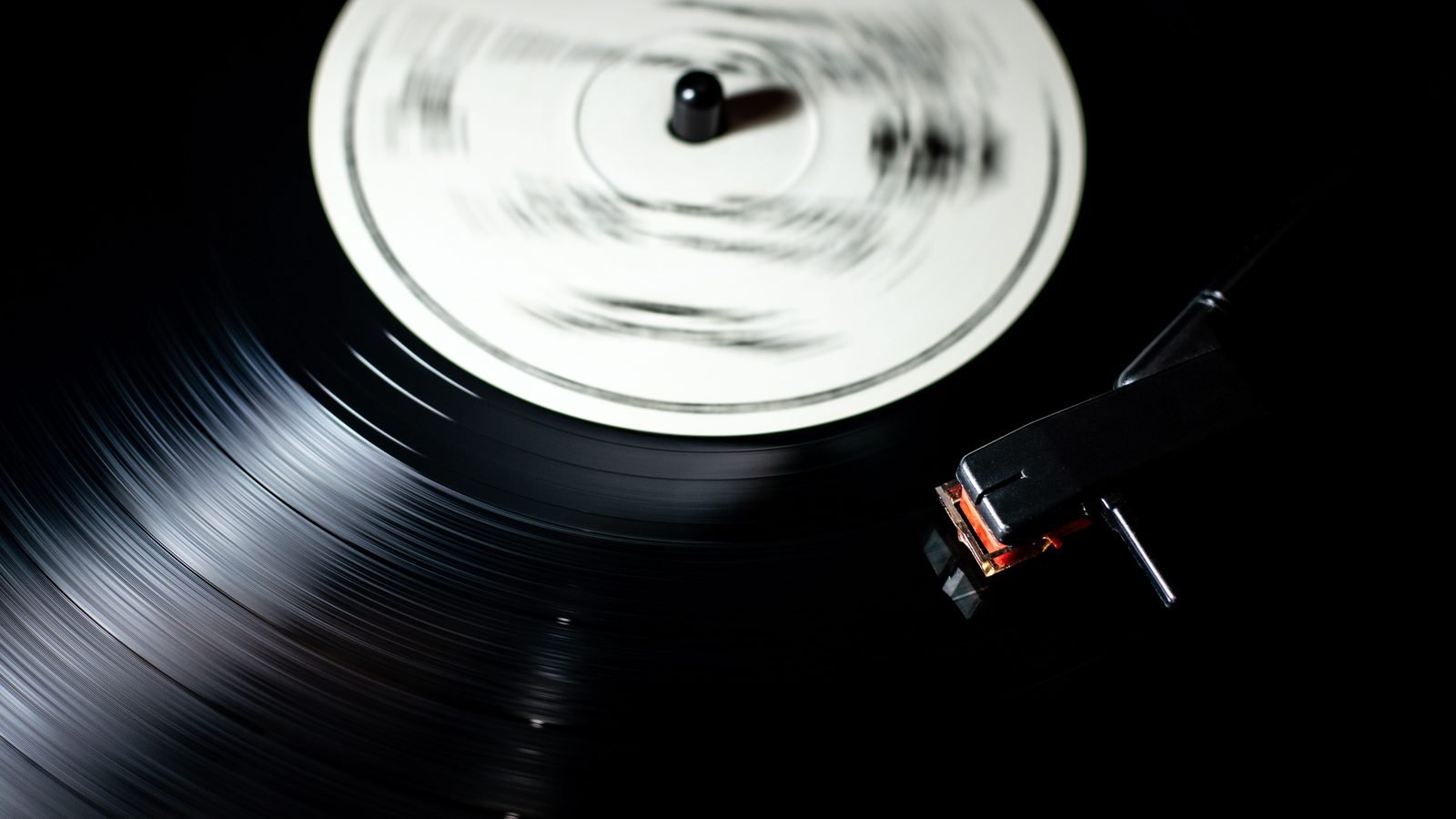 Close-up of a spinning vinyl record on a turntable