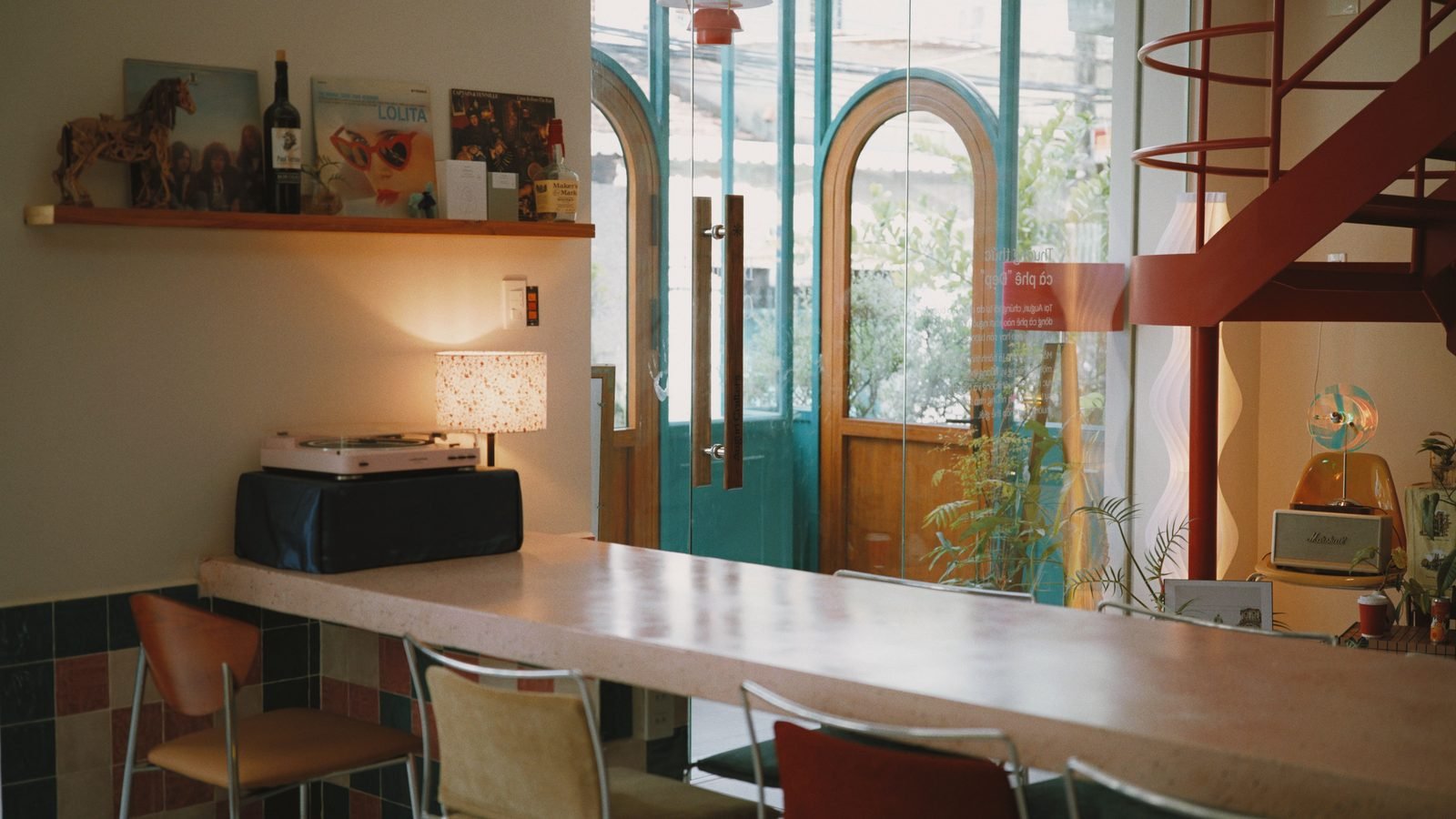 Warm interior of a cafe with vinyl records and a bar area