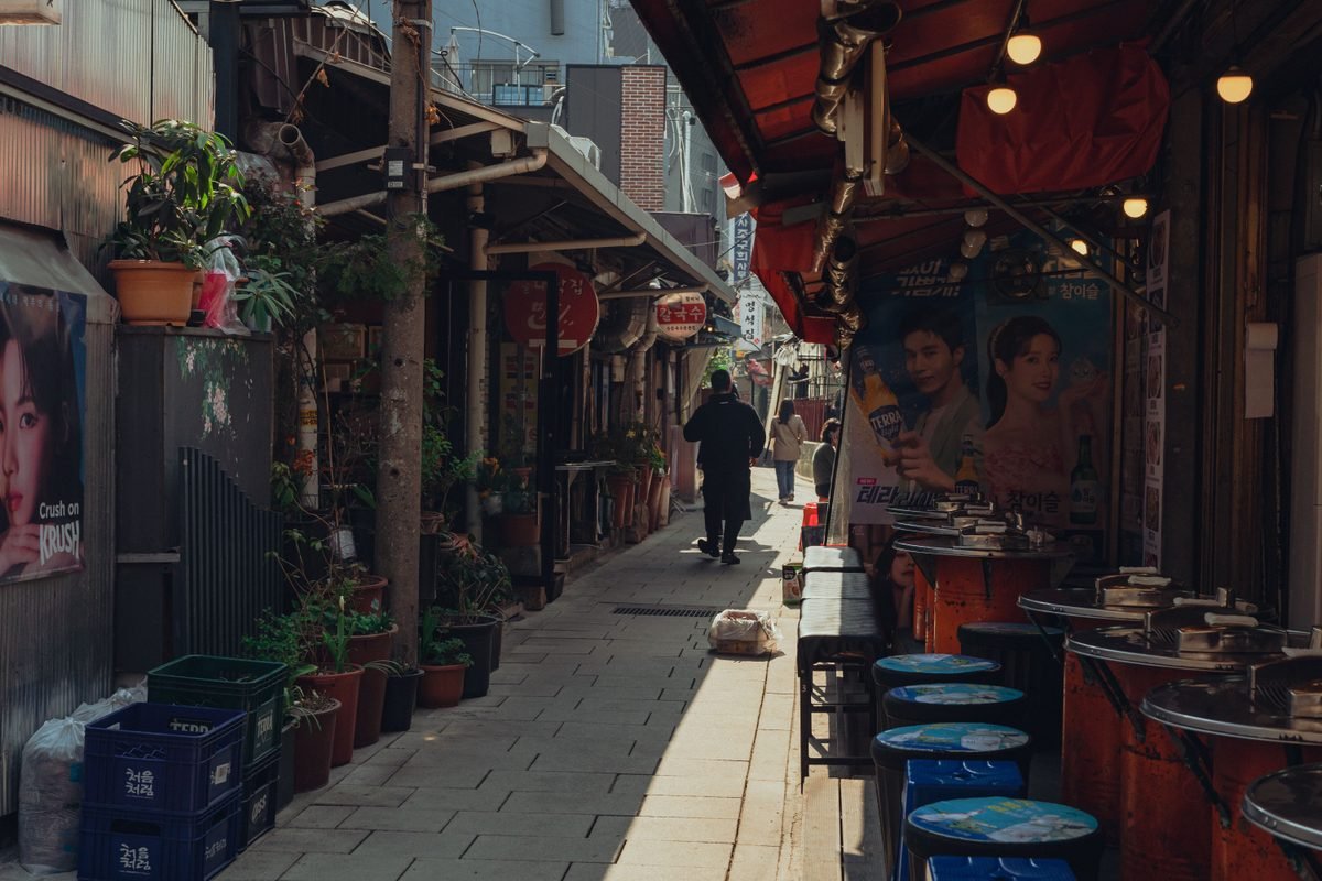 A vibrant traditional street in Seoul with colorful shops