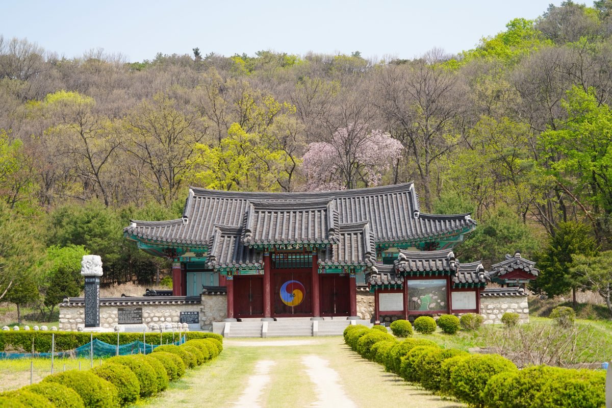 Traditional Korean temple nestled in a lush springtime forest