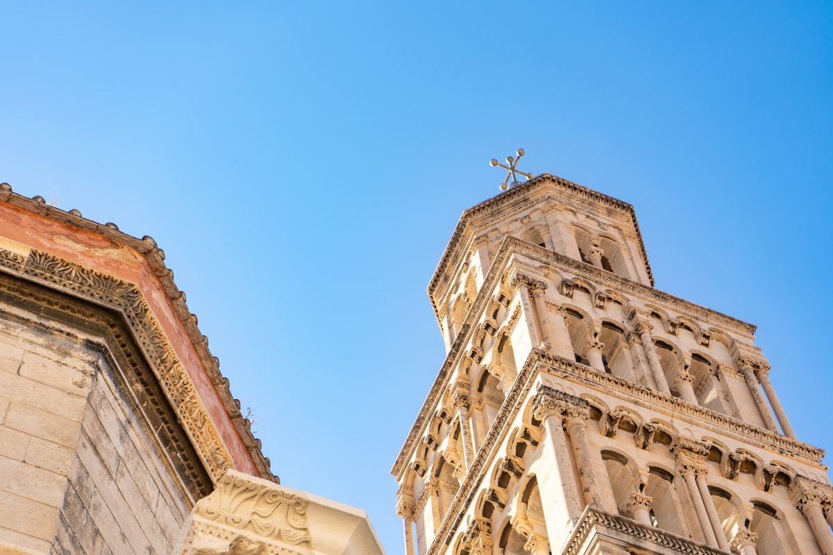 Detailed view of the cathedral tower in Split against a blue sky