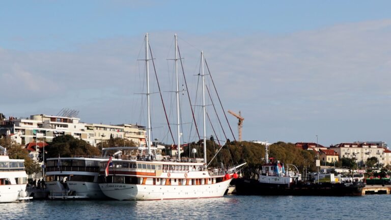 Sailboats docked along the historic harbor in Split