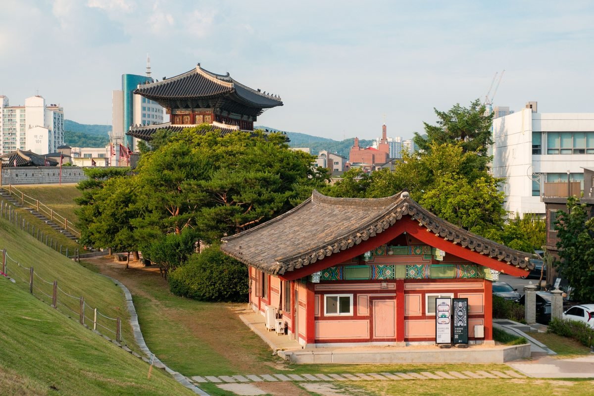 Traditional Korean pavilion and modern city buildings