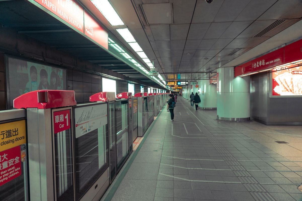 Commuters waiting on a subway platform at Taipei Main Station