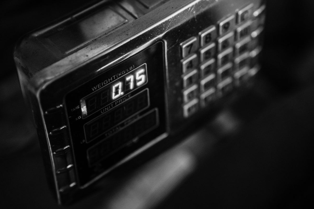 A close-up of a digital weight scale display in monochrome.